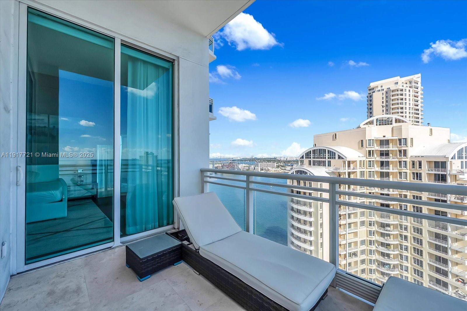 900 Brickell Key Boulevard, Unit 2304 Miami, FL 33131 - Photo 22 of 55 a view of a balcony with chair