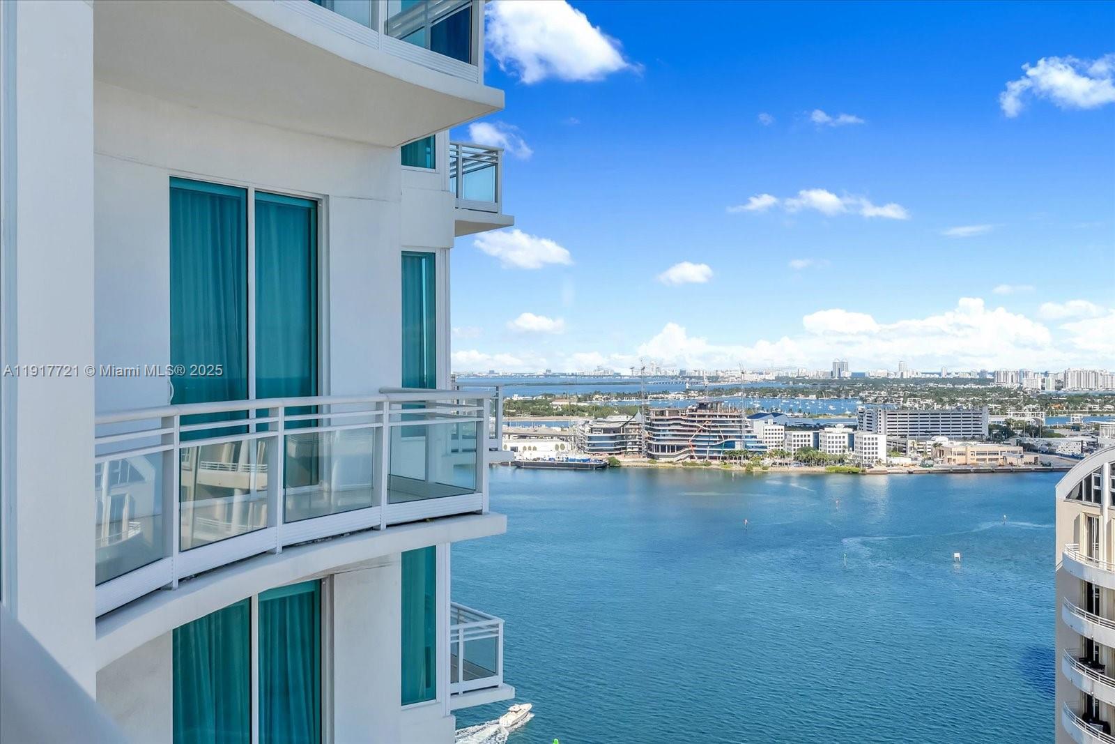 900 Brickell Key Boulevard, Unit 2304 Miami, FL 33131 - Photo 23 of 55 a view of a swimming pool and lounge chair