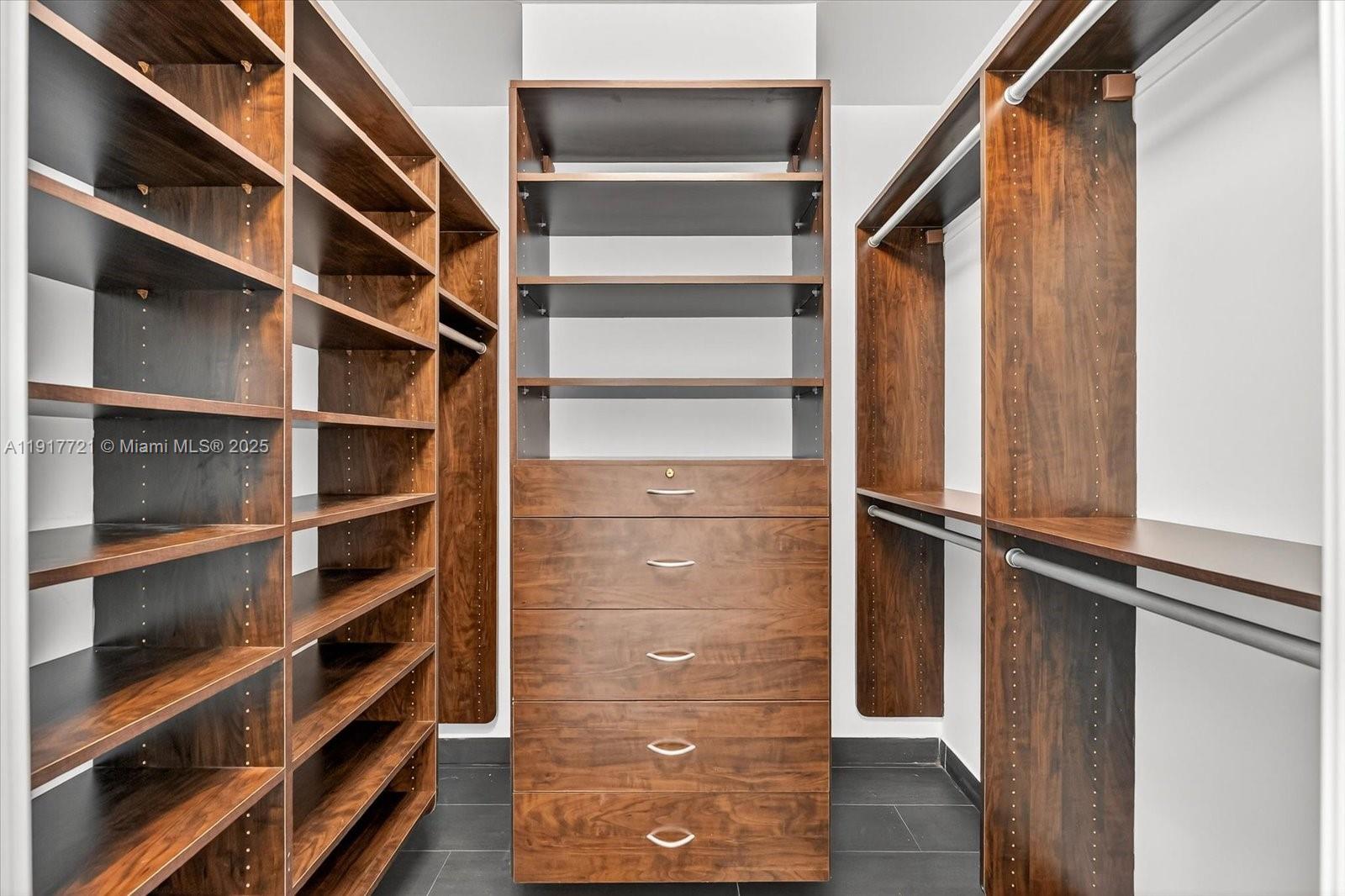 900 Brickell Key Boulevard, Unit 2304 Miami, FL 33131 - Photo 35 of 55 a view of walk in closet with empty racks