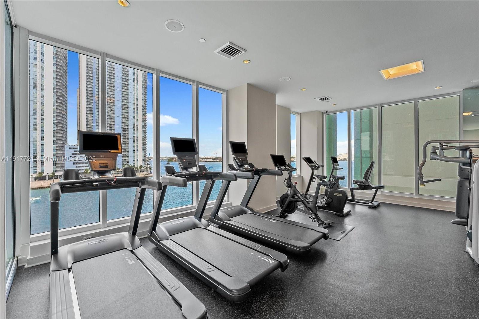 900 Brickell Key Boulevard, Unit 2304 Miami, FL 33131 - Photo 41 of 55 a view of a room with gym equipment