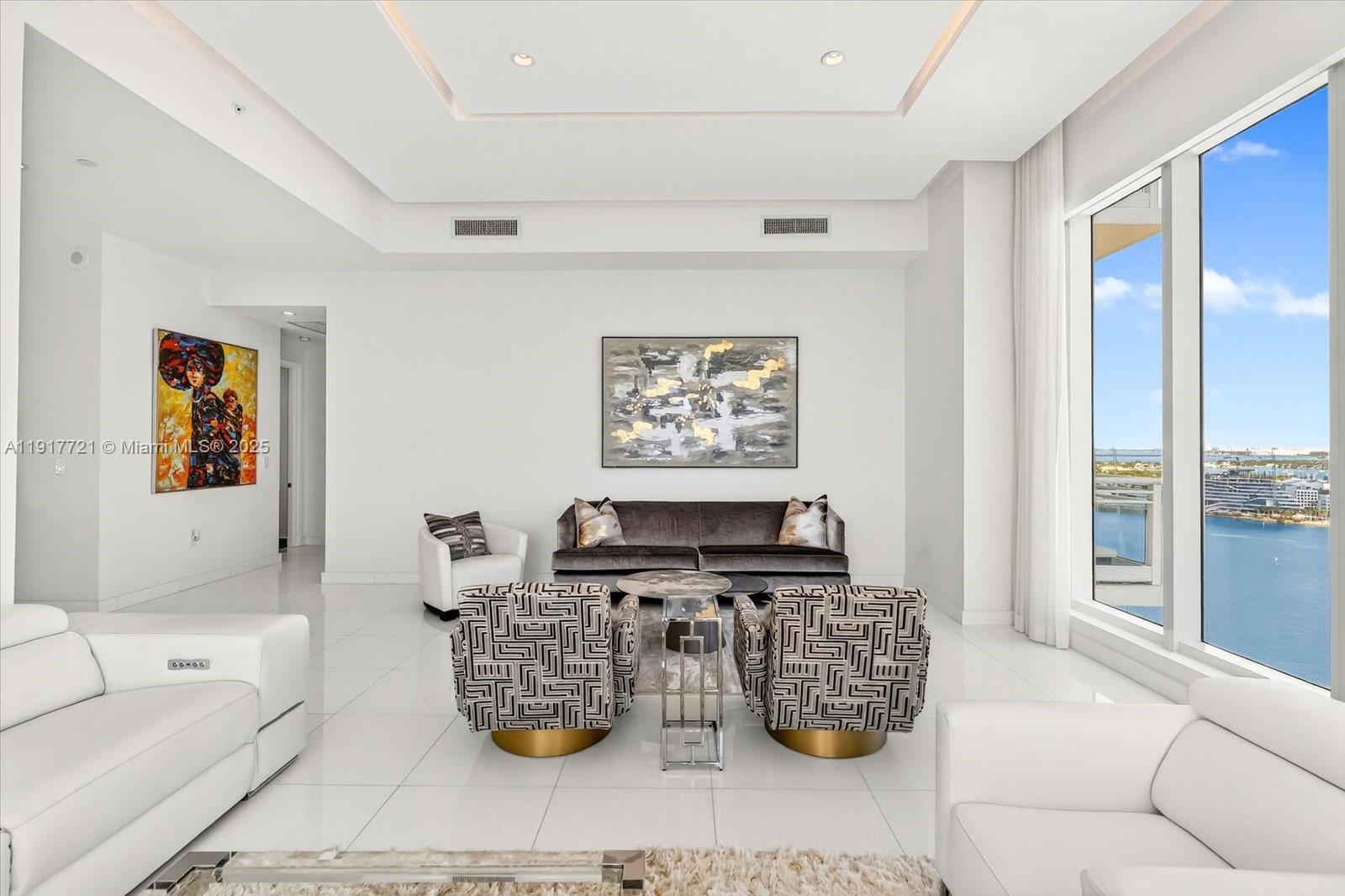 900 Brickell Key Boulevard, Unit 2304 Miami, FL 33131 - Photo 7 of 55 a living room with furniture and view of kitchen