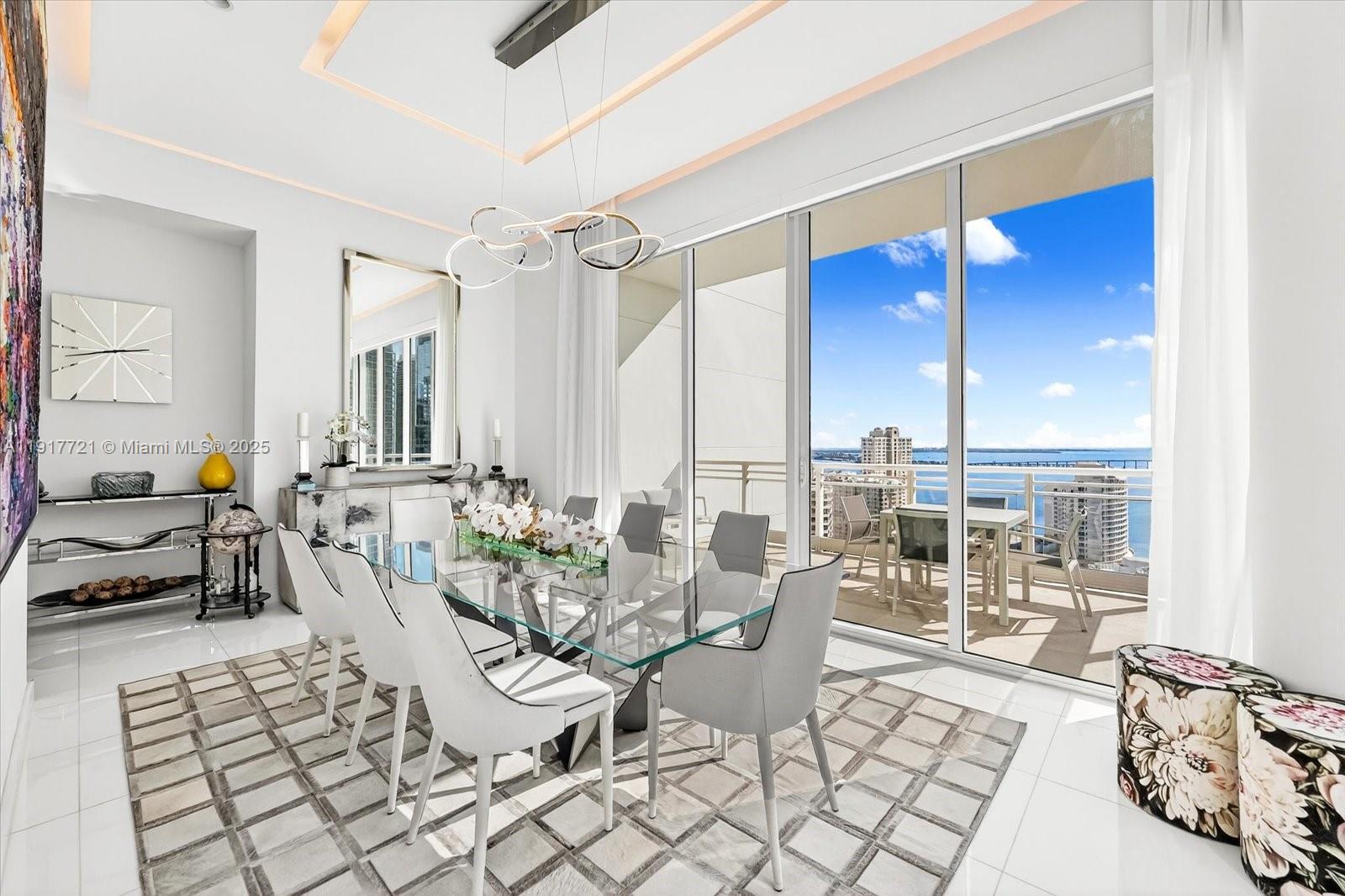 900 Brickell Key Boulevard, Unit 2304 Miami, FL 33131 - Photo 9 of 55 a living room with furniture