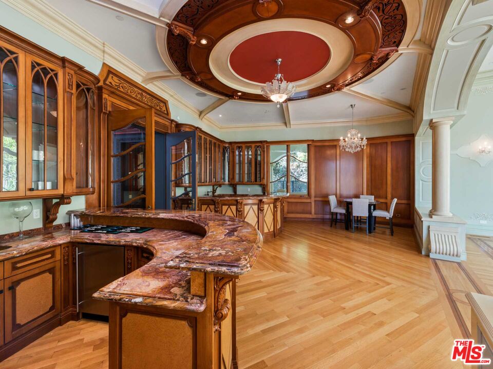 901 North Alpine Drive Beverly Hills, CA 90210 - Photo 18 of 33 a very nice looking room with a large window and furniture