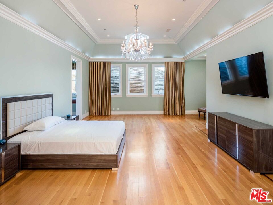 901 North Alpine Drive Beverly Hills, CA 90210 - Photo 31 of 33 a bedroom with a bed and a flat screen tv