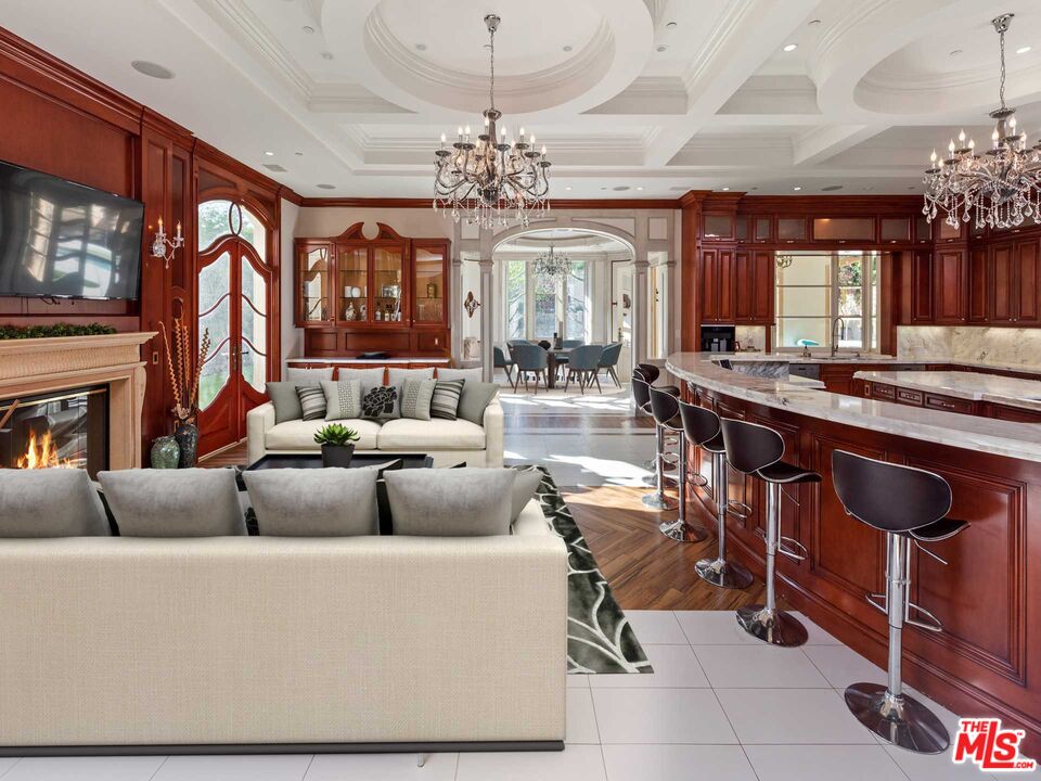 901 North Alpine Drive Beverly Hills, CA 90210 - Photo 7 of 33 a living room with fireplace furniture and a chandelier