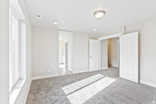 257 North Slant Road, Unit 51M Mapleton, UT 84660 - Photo 14 of 24 Unfurnished bedroom featuring light colored carpet
