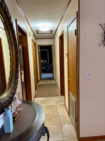 a bedroom with a bed and a night stand