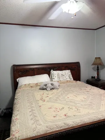 a view of living room cabinets and a wooden floor