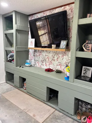 a bedroom with a bed and a mirror