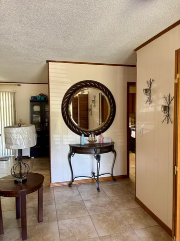 a view of a dining room with furniture and window