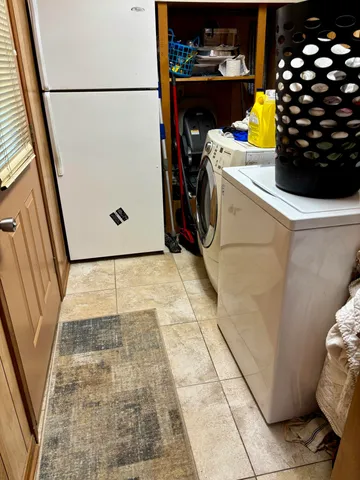 a kitchen with stainless steel appliances granite countertop a stove top oven a sink a counter space and cabinets