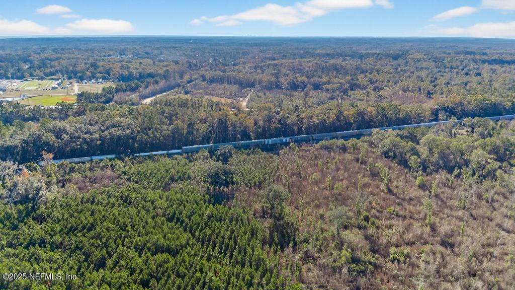 0 Pony Lane Callahan, FL 32011 - Photo 8 of 15 a view of a lake with a yard