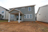 256 Yellow River Way Garner, NC 27529 - Photo 23 of 23 a front view of a house with a garden