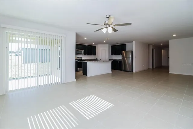 a view of a kitchen with a sink and cabinet area