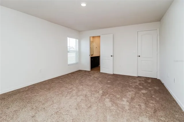 a view of an empty room and window