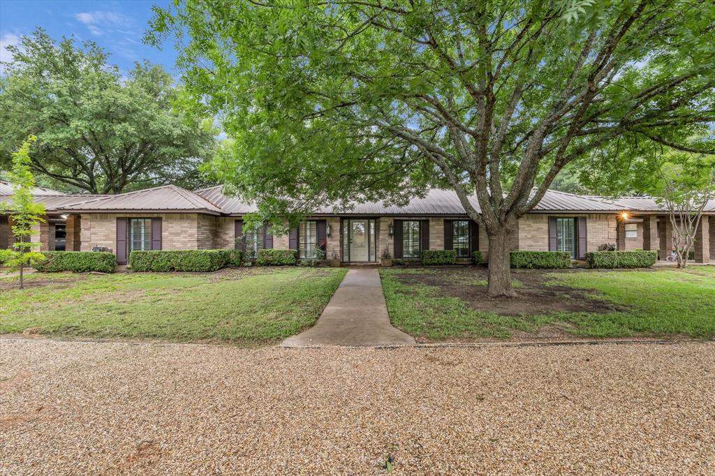 15796 Chapel Road Lorena, TX 76655 - Photo 6 of 28 Ranch-style home with a metal roof and a front yard
