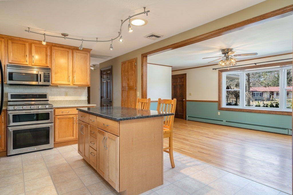 30 County Road Holyoke, MA 01040 - Photo 17 of 38 a kitchen with stainless steel appliances granite countertop a stove and a refrigerator