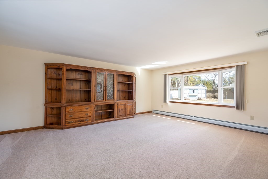 30 County Road Holyoke, MA 01040 - Photo 21 of 38 an empty room with furniture and large window