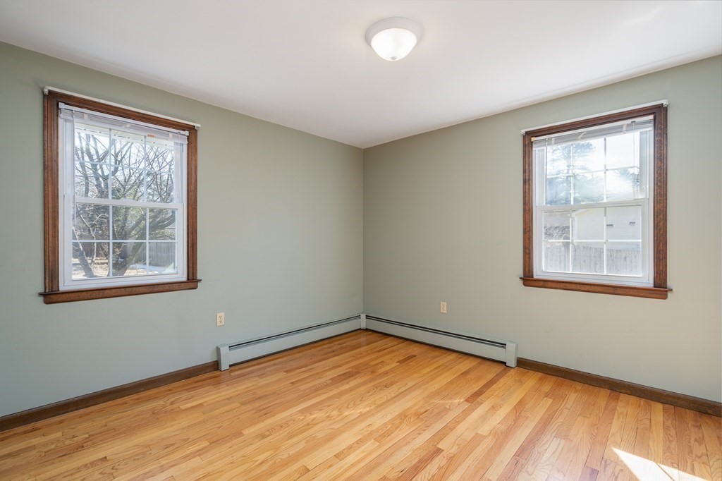 30 County Road Holyoke, MA 01040 - Photo 33 of 38 a view of empty room with wooden floor and fan