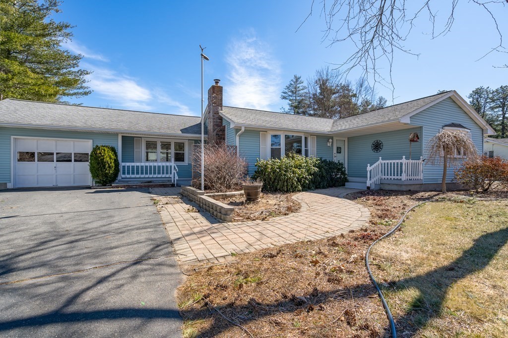 30 County Road Holyoke, MA 01040 - Photo 6 of 38 a front view of a house with a yard and potted plants
