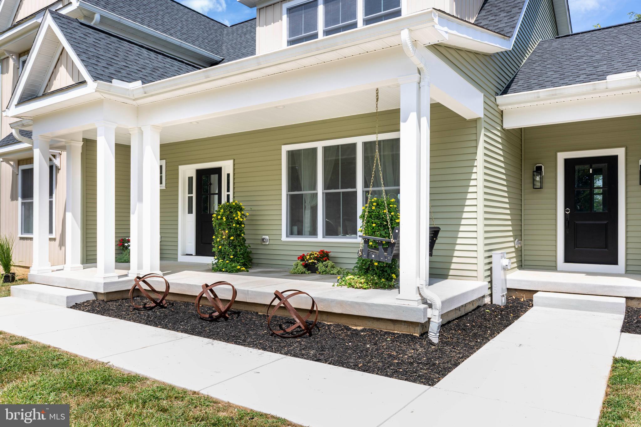 1865 Hughes Shop Road Westminster, MD 21158 - Photo 11 of 46 a front view of a house with large windows and plants