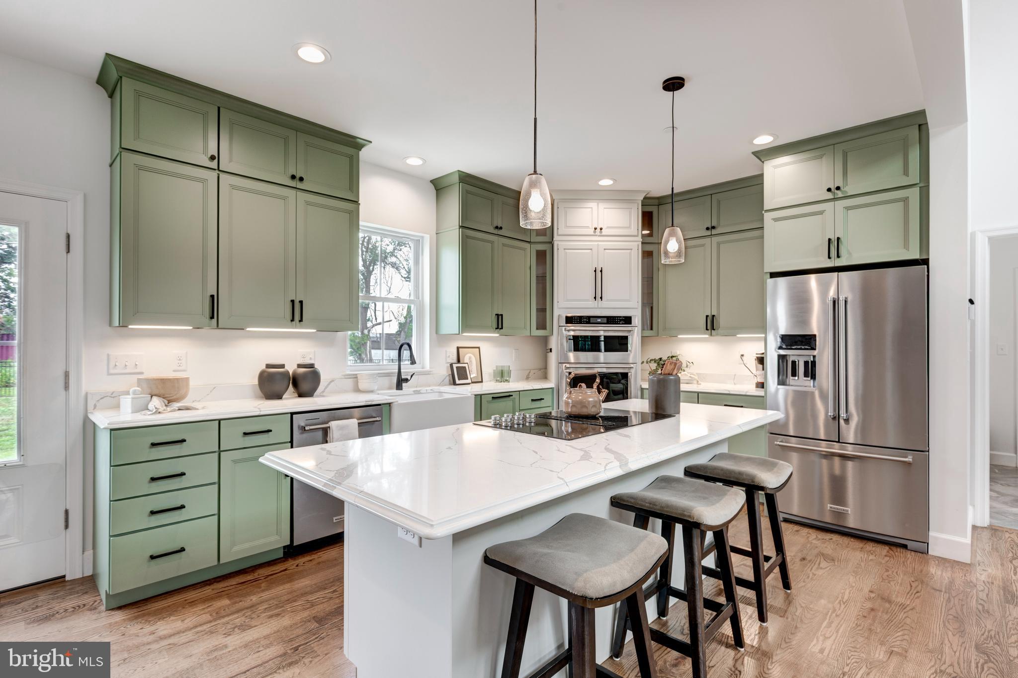 1865 Hughes Shop Road Westminster, MD 21158 - Photo 20 of 46 a kitchen with refrigerator a sink and chairs