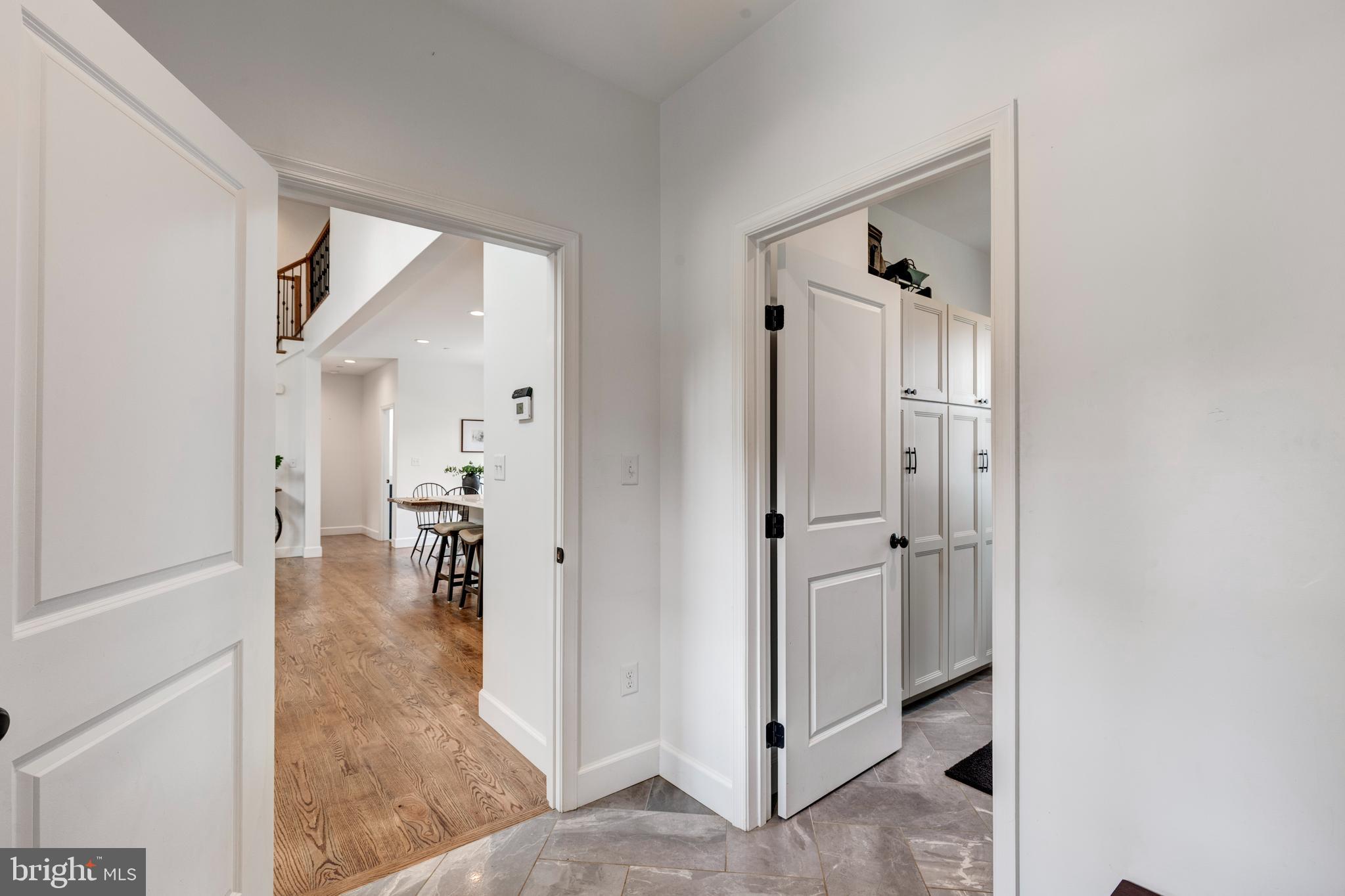 1865 Hughes Shop Road Westminster, MD 21158 - Photo 27 of 46 a view of a hallway with closet and a livingroom with furniture