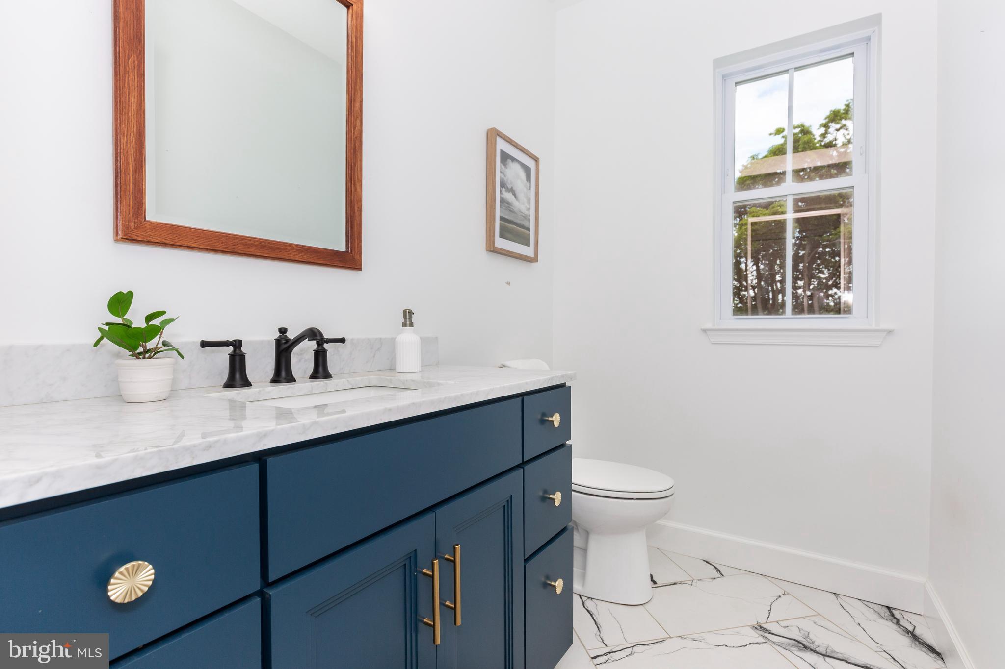 1865 Hughes Shop Road Westminster, MD 21158 - Photo 30 of 46 a bathroom with a granite countertop sink mirror and toilet