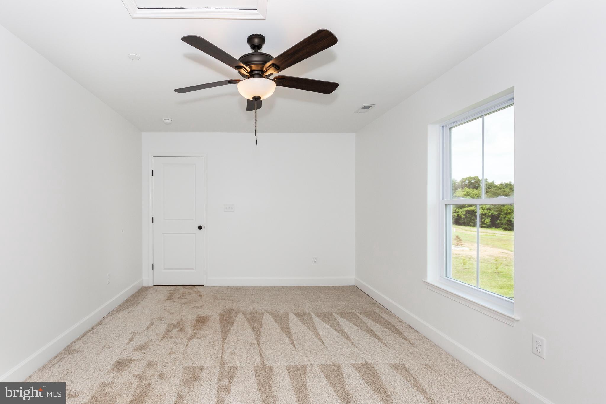 1865 Hughes Shop Road Westminster, MD 21158 - Photo 37 of 46 an empty room with a window and a fan