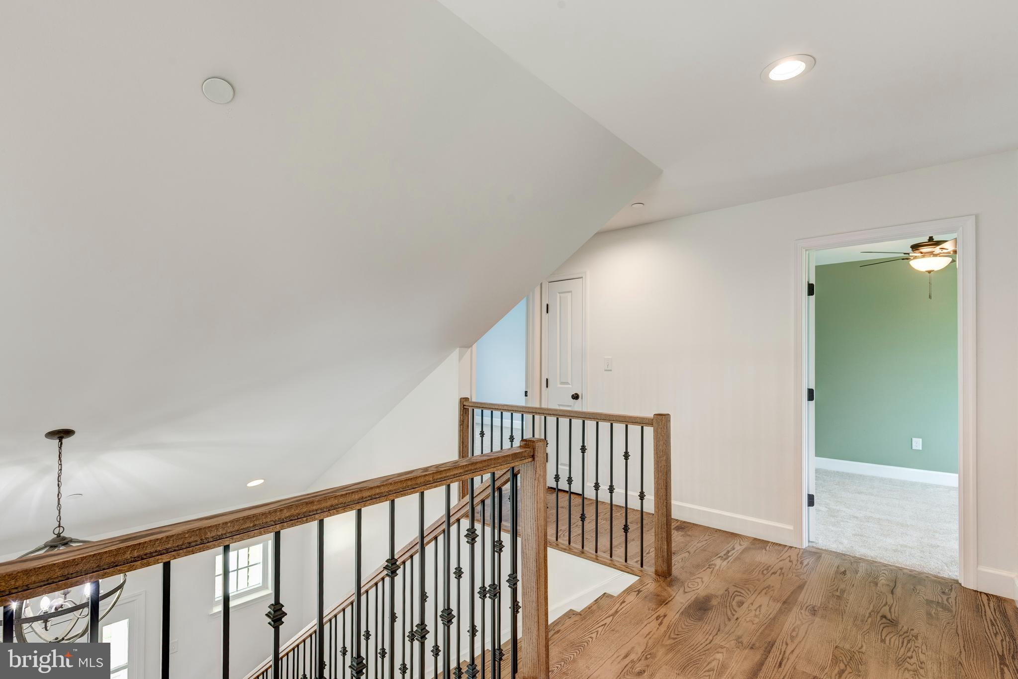 1865 Hughes Shop Road Westminster, MD 21158 - Photo 39 of 46 a view of staircase with railing and a chandelier fan