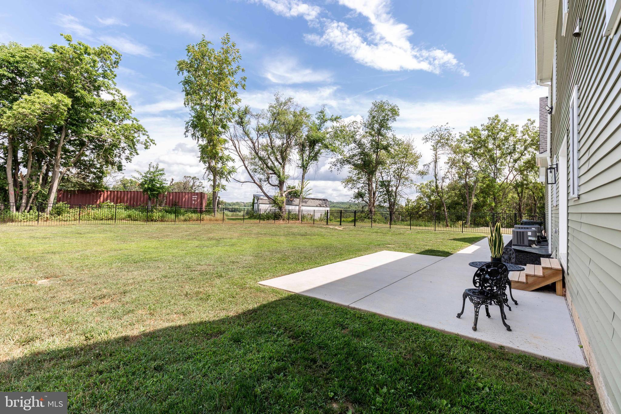 1865 Hughes Shop Road Westminster, MD 21158 - Photo 8 of 46 a view of a swimming pool with lawn chairs and a big yard
