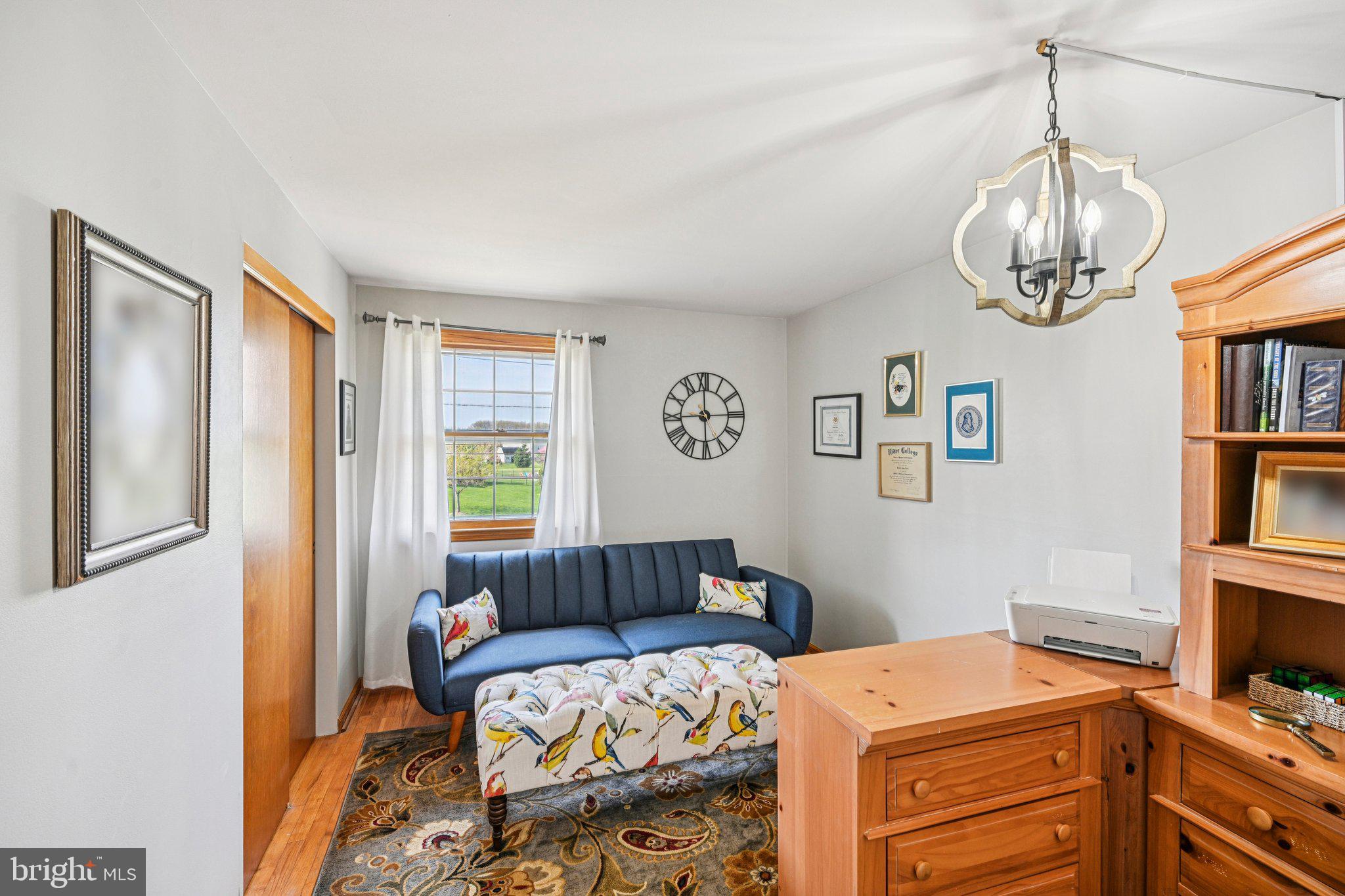 25618 Mt Pleasant Road Columbus, NJ 08022 - Photo 26 of 61 a bedroom with a bed and a chandelier