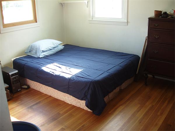 496 Harvard Road Lancaster, MA 01523 - Photo 11 of 12 a bedroom with a bed and a window