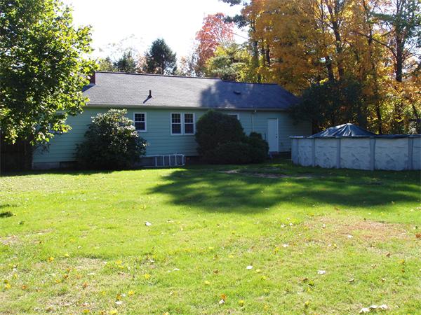 496 Harvard Road Lancaster, MA 01523 - Photo 3 of 12 a view of a house with a yard and a garden