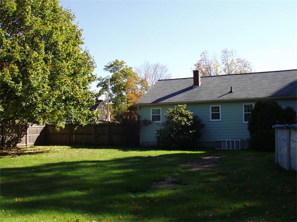 496 Harvard Road Lancaster, MA 01523 - Photo 4 of 12 a view of a house next to a yard