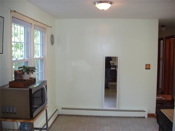 496 Harvard Road Lancaster, MA 01523 - Photo 10 of 12 a view of an entryway with wooden floor