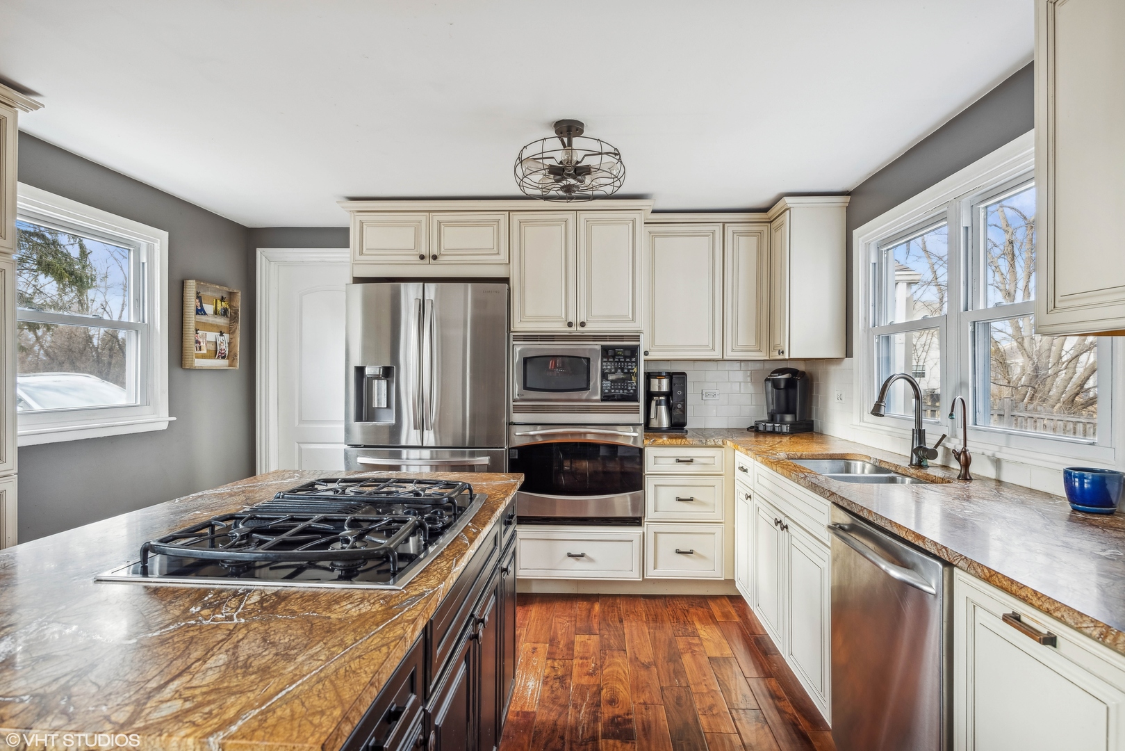 7102 Silver Lake Road Cary, IL 60013 - Photo 11 of 32 a kitchen with stainless steel appliances kitchen island granite countertop a stove a sink and a refrigerator
