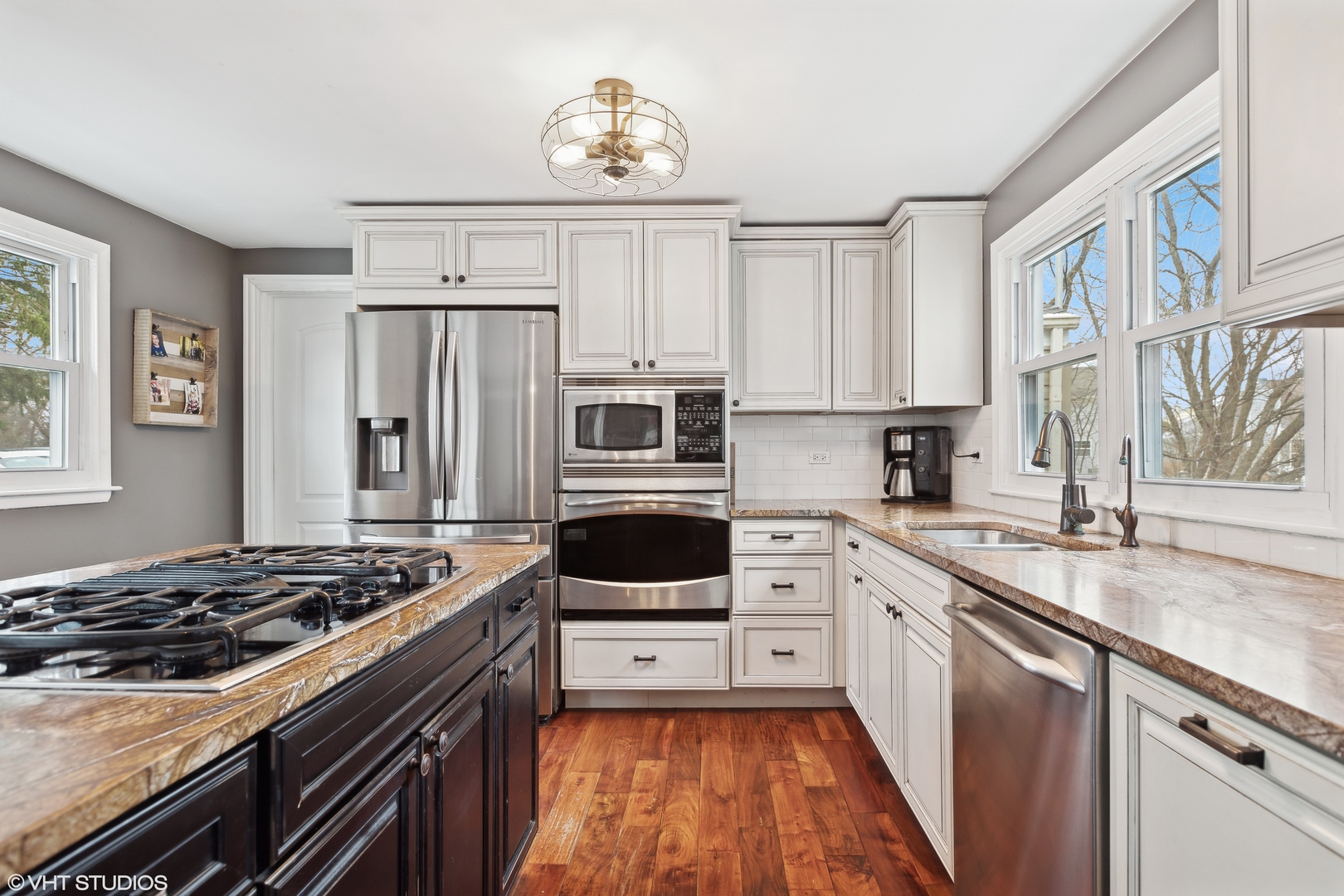 7102 Silver Lake Road Cary, IL 60013 - Photo 13 of 32 a kitchen with stainless steel appliances a stove a sink and a refrigerator