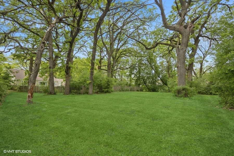 7102 Silver Lake Road Cary, IL 60013 - Photo 25 of 32 a view of a grassy field with trees in the background