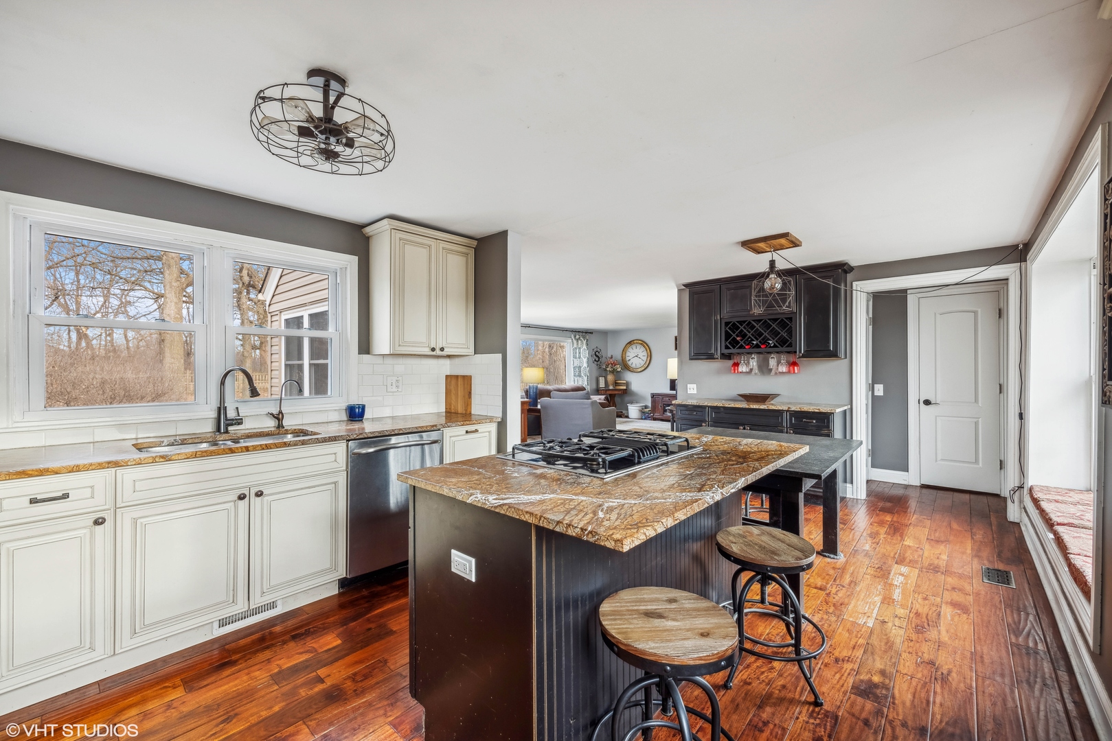 7102 Silver Lake Road Cary, IL 60013 - Photo 10 of 32 a kitchen with a sink cabinets and wooden floor
