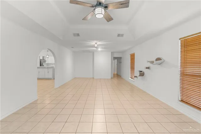 a living room with lots of furniture and white walls