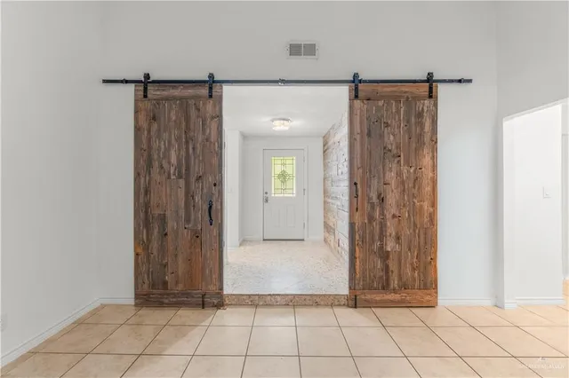 a view of a bathroom with a shower and a sink