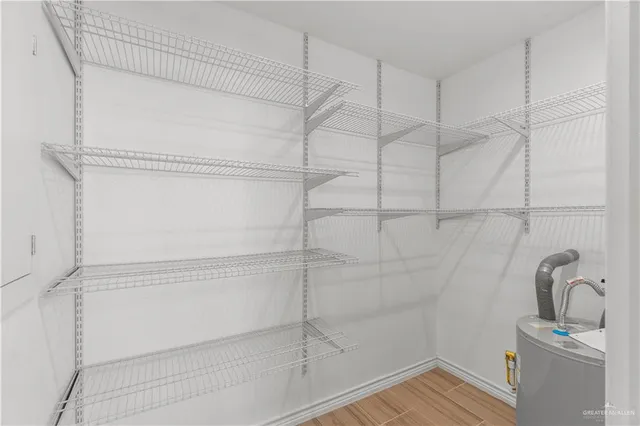 a bathroom with a shower and a sink