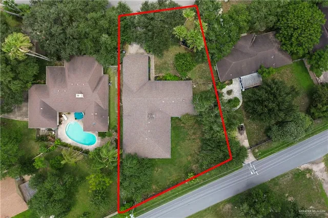 a view of a tree in front of a house