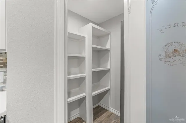 a utility room with cabinets washer and dryer