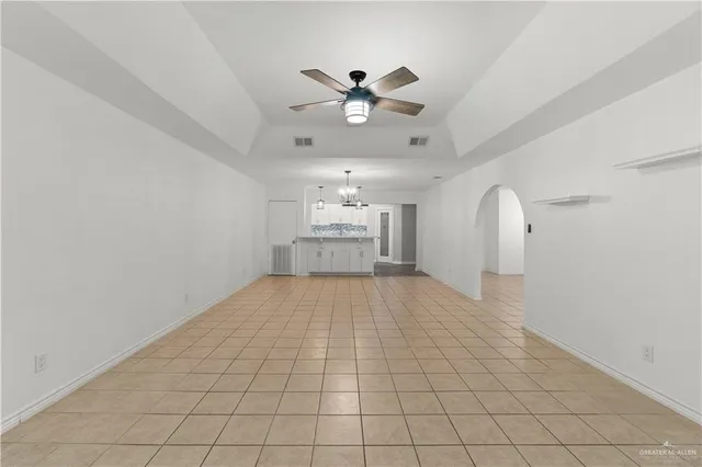 a kitchen with granite countertop white cabinets and stainless steel appliances