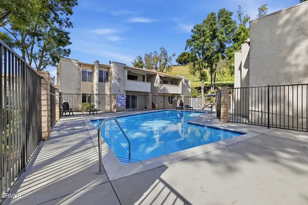 a view of a swimming pool with a lounge chairs