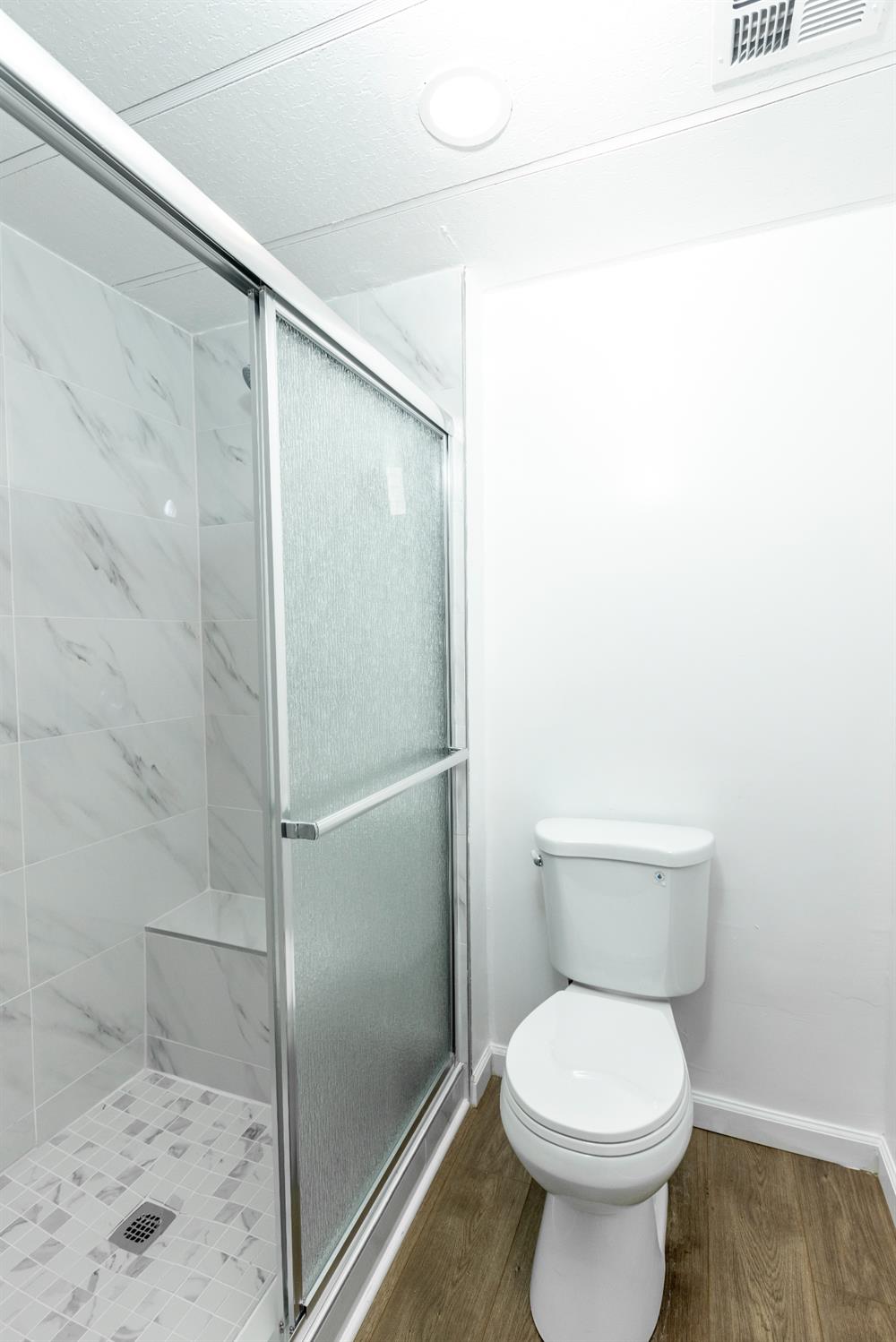 3901 Lake Road, Unit 151 West Sacramento, CA 95691 - Photo 17 of 18 a bathroom with a toilet and a shower