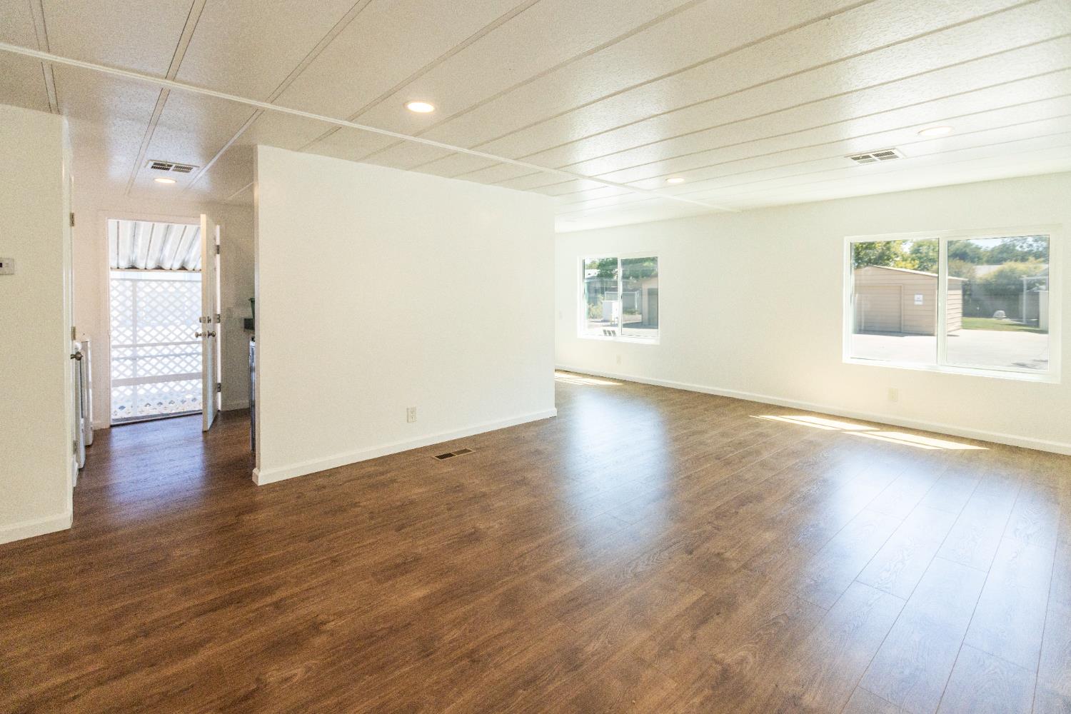 3901 Lake Road, Unit 151 West Sacramento, CA 95691 - Photo 8 of 18 a view of a room with wooden floor and a window