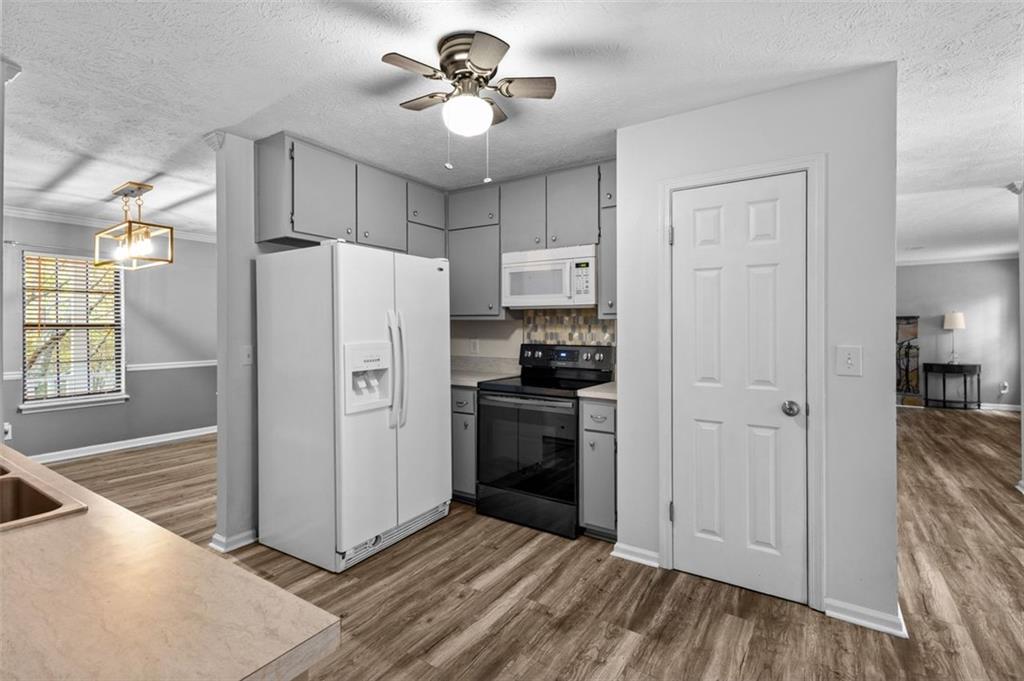 2888 Cardinal Trace Duluth, GA 30096 - Photo 14 of 51 a kitchen with stainless steel appliances a refrigerator and a stove